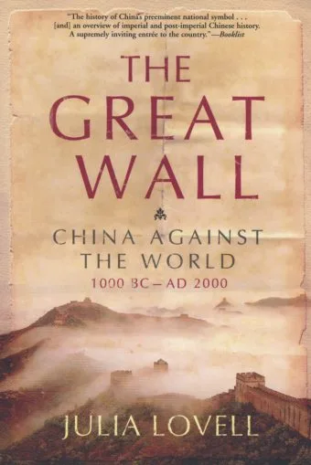 Author Writing On The Great Wall Of China, With A Notebook And Pen In Hand, Overlooking The Vast Landscape