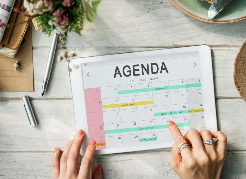 An Author Using A Calendar Or Planner To Create A Book Marketing Plan, Emphasizing The Importance Of A Marketing Plan.